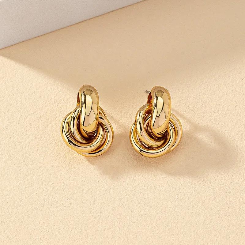 Boucles d'oreilles créoles nœud en or/argent brillant pour femmes
