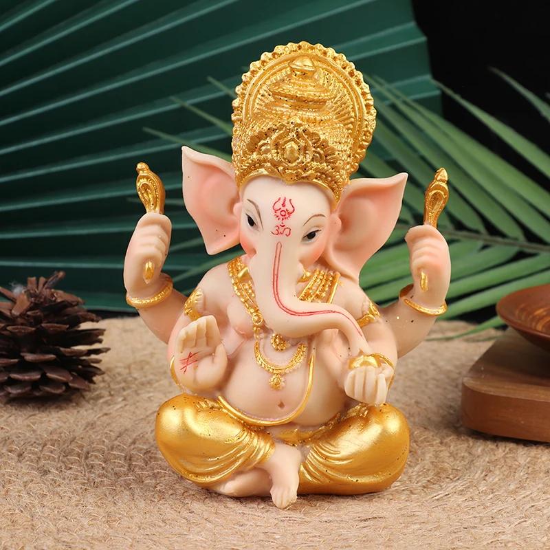 Goldene Ganesha- und Buddha-Statuen: Elefanten für die Heimdekoration